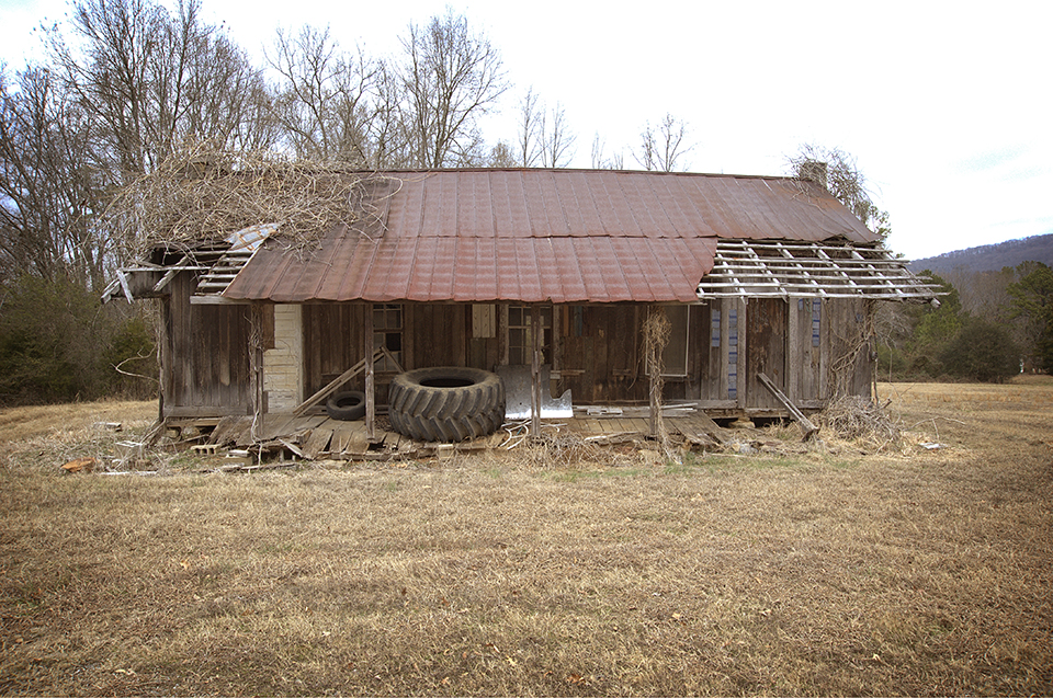 Old Building With Tractor Tire